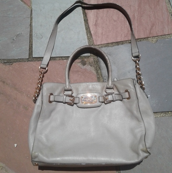 grey and rose gold purse